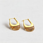 Gold Pia U-Shape Hoop Earrings with an amber translucent inset on a light grey background