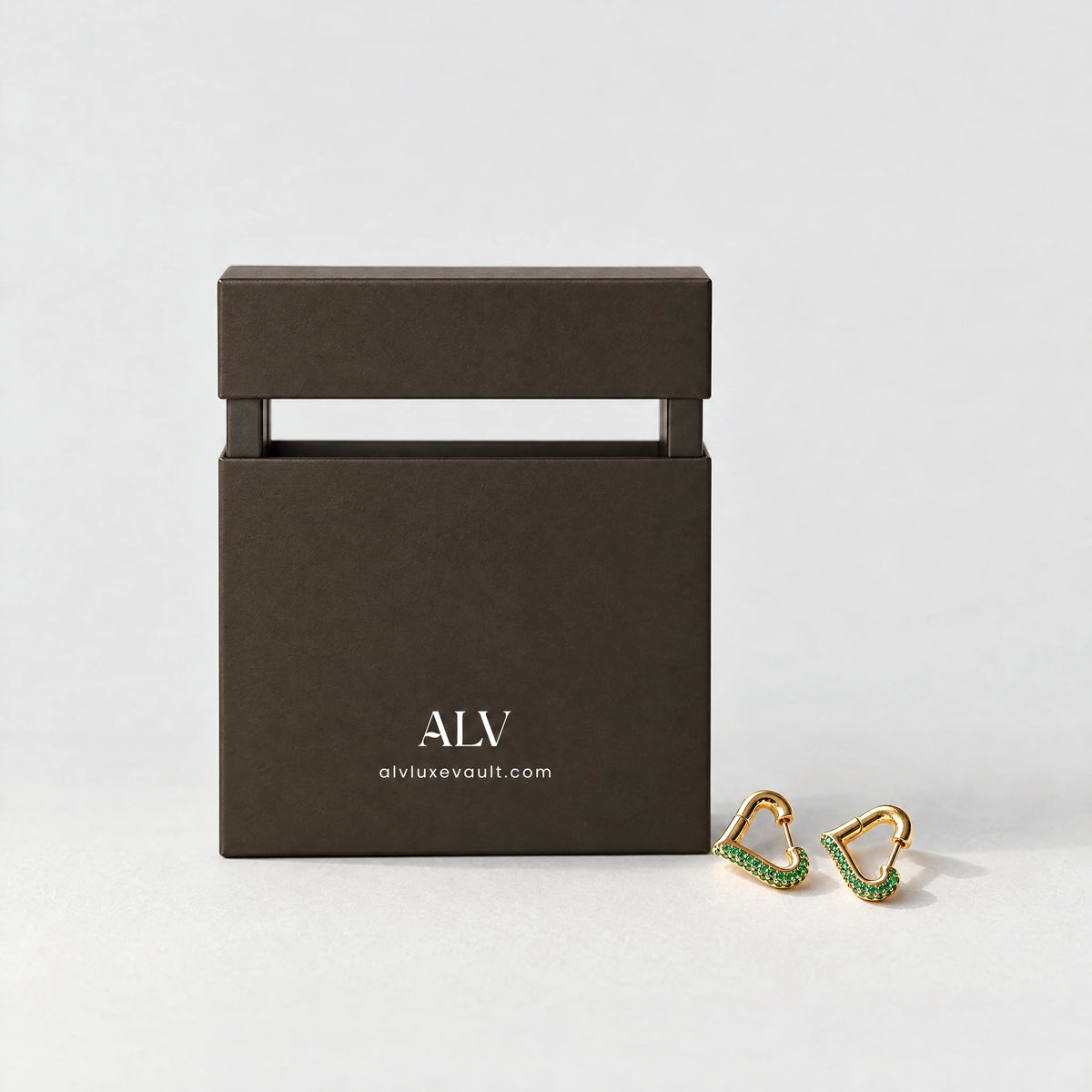 Cora Crystal Heart Hoop Earrings beside the ALV gift box