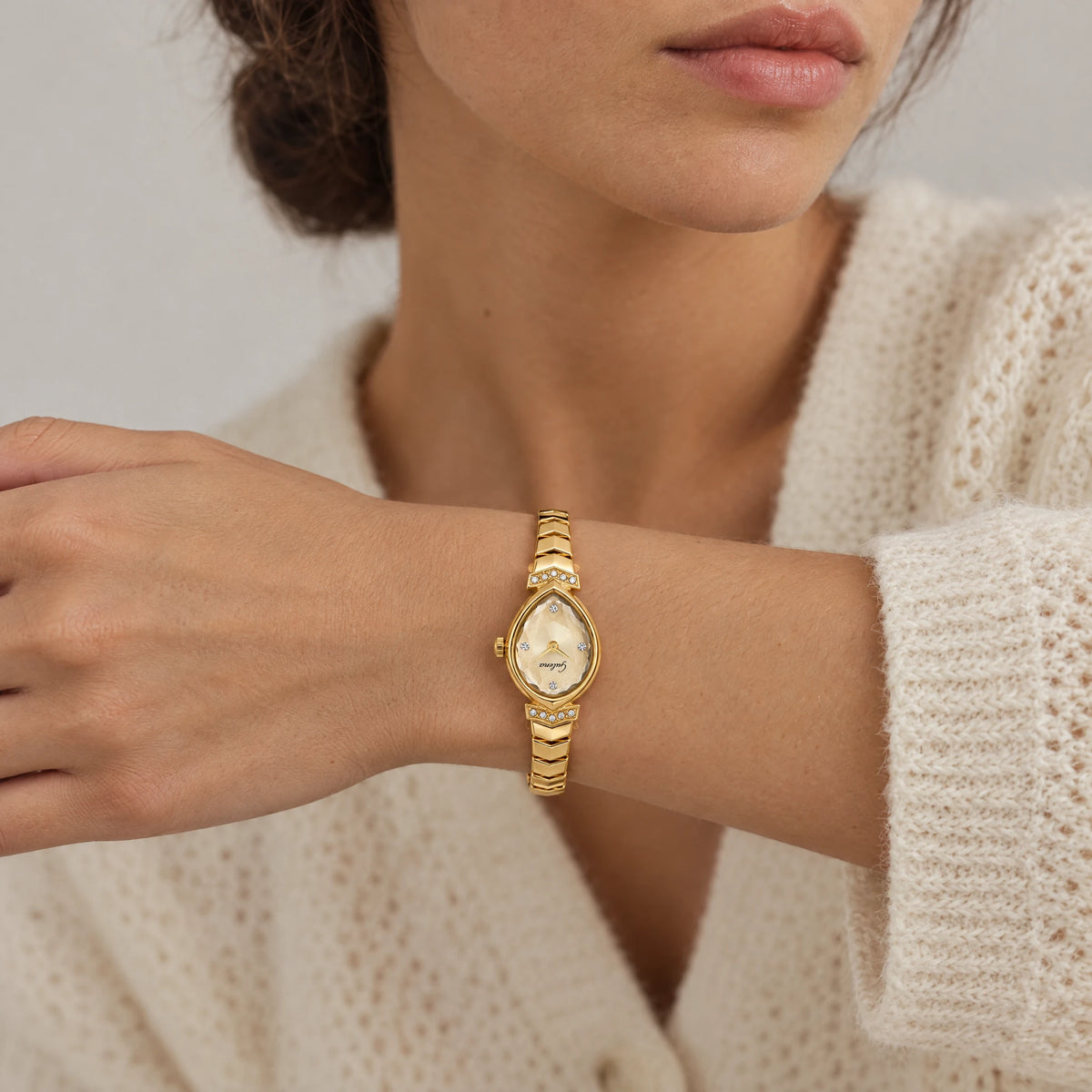ISLA Teardrop Bracelet Watch worn on the left wrist of a brunette woman, seen from the front with the dial upside-down as on a real wrist
