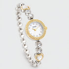 LOLA Heart Bracelet Watch in two-tone gold and silver with a crystal-rimmed dial and heart links on a light grey background