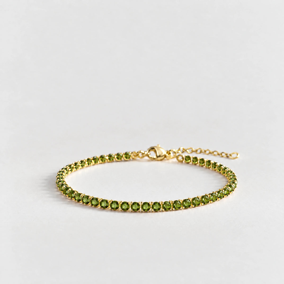 MAYA Birthstone Tennis Bracelet in gold plating with peridot-green crystals for August