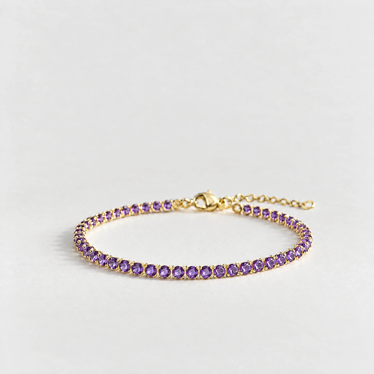 MAYA Birthstone Tennis Bracelet in gold plating with violet crystals for February
