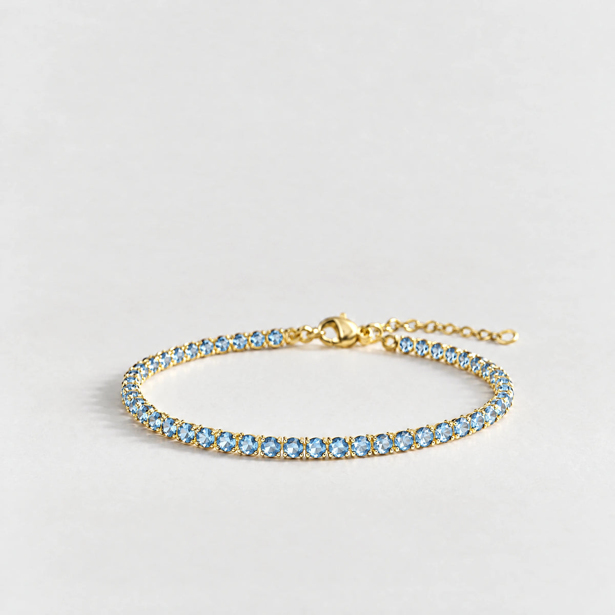 MAYA Birthstone Tennis Bracelet in gold plating with light-blue crystals for March