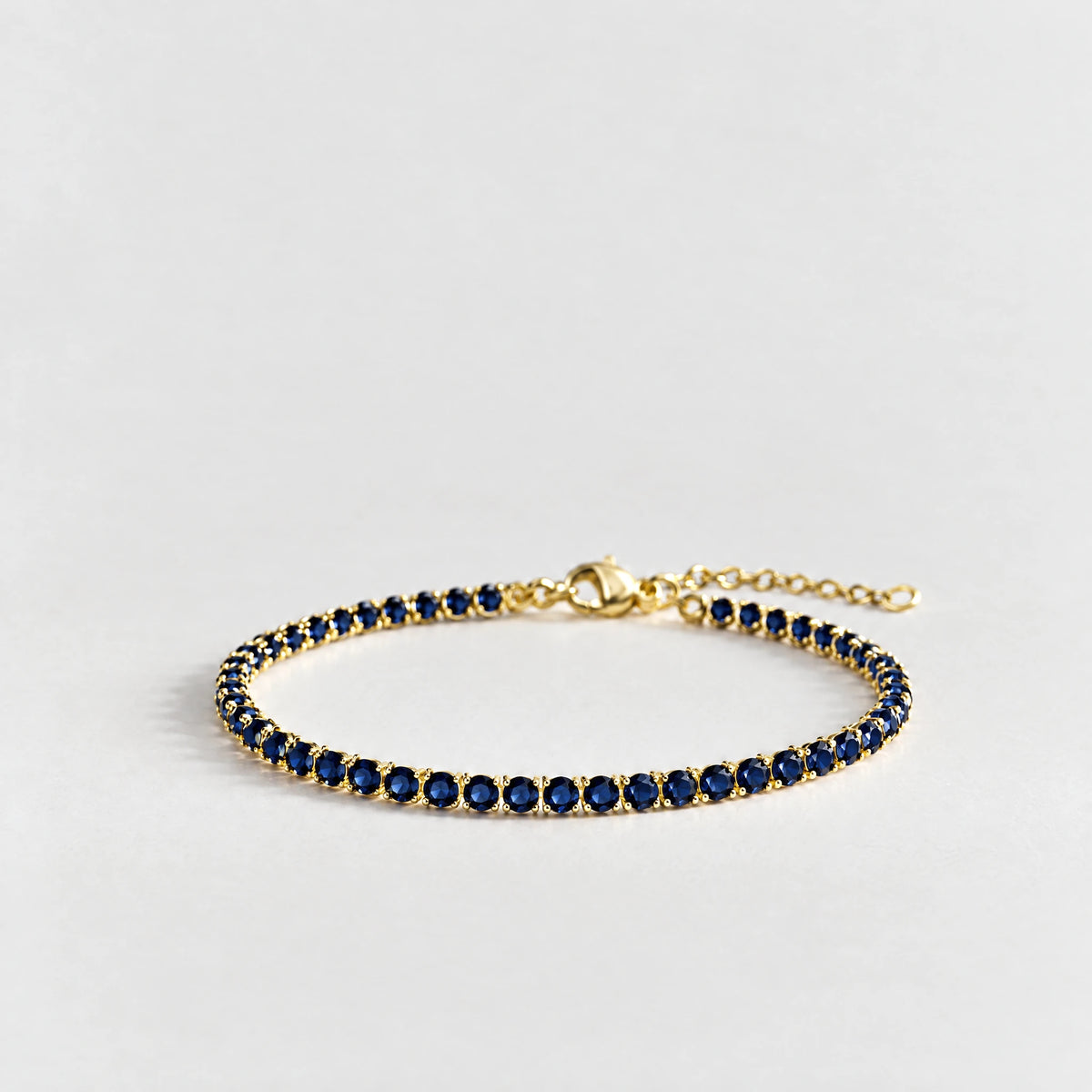 MAYA Birthstone Tennis Bracelet in gold plating with sapphire-blue crystals for September