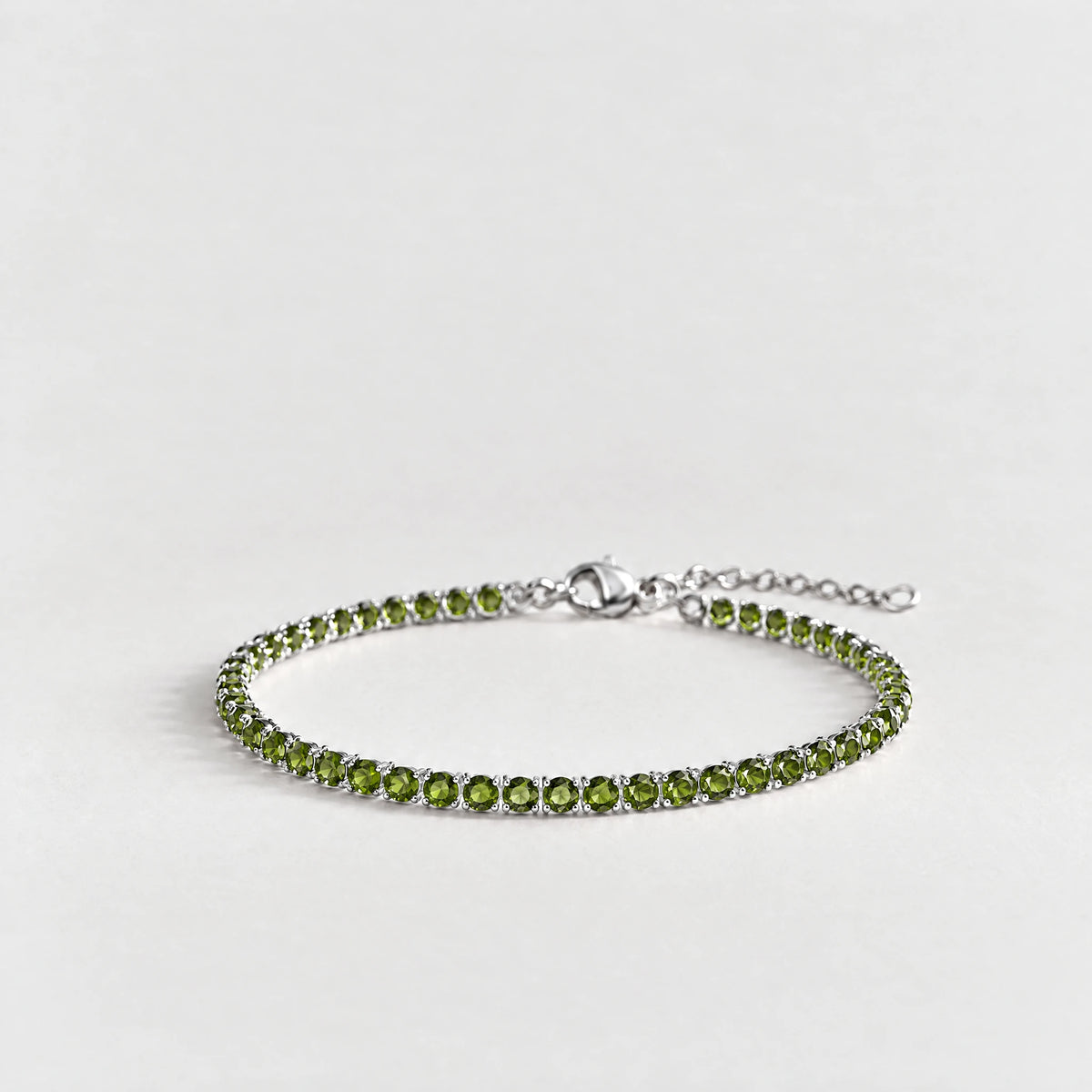 MAYA Birthstone Tennis Bracelet in silver plating with peridot-green crystals for August