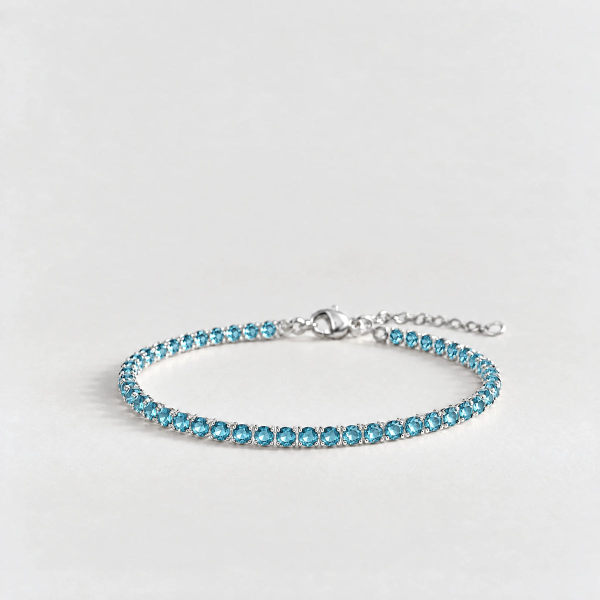 MAYA Birthstone Tennis Bracelet in silver plating with aquamarine-blue crystals for December