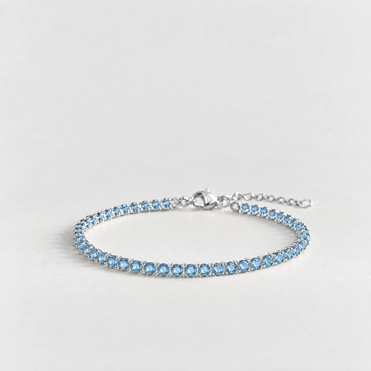 MAYA Birthstone Tennis Bracelet in silver plating with light-blue crystals for March